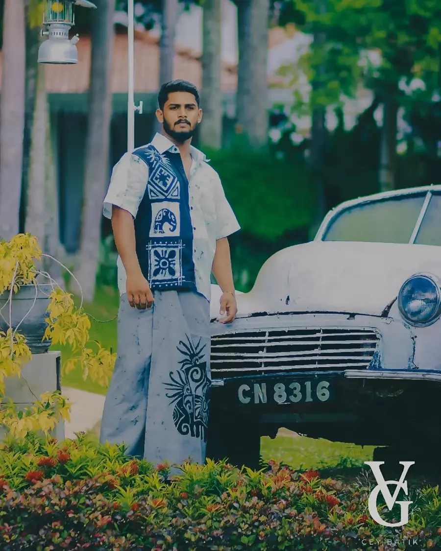 Man styled in a blue and white batik shirt with matching sarong